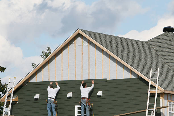 Professional Siding Installation technician working in Lehigh Acres, FL